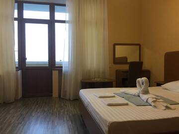 Фото номера Четырехместный номер с видом на море Гостиница Guest House Brizas г. Лоо 2
